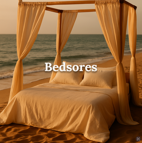 Elegant canopy bed on the beach at sunset, visually referencing comfort and relief for prolonged pressure on sensitive skin with text reading ‘Bedsores'.